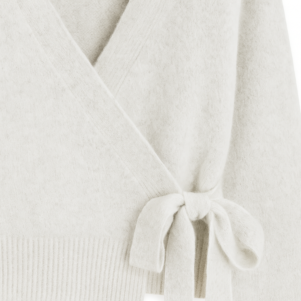 Long-sleeve wrap sweater with ribbed cuffs and hem, featuring a tie closure at the waist.