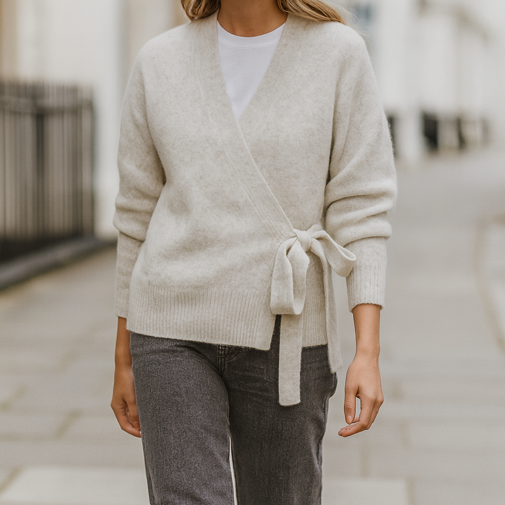 Long-sleeve wrap sweater with ribbed cuffs and hem, featuring a tie closure at the waist.